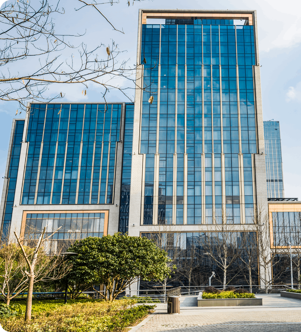 Modern glass facade high rise building viewed from ground level on a clear day