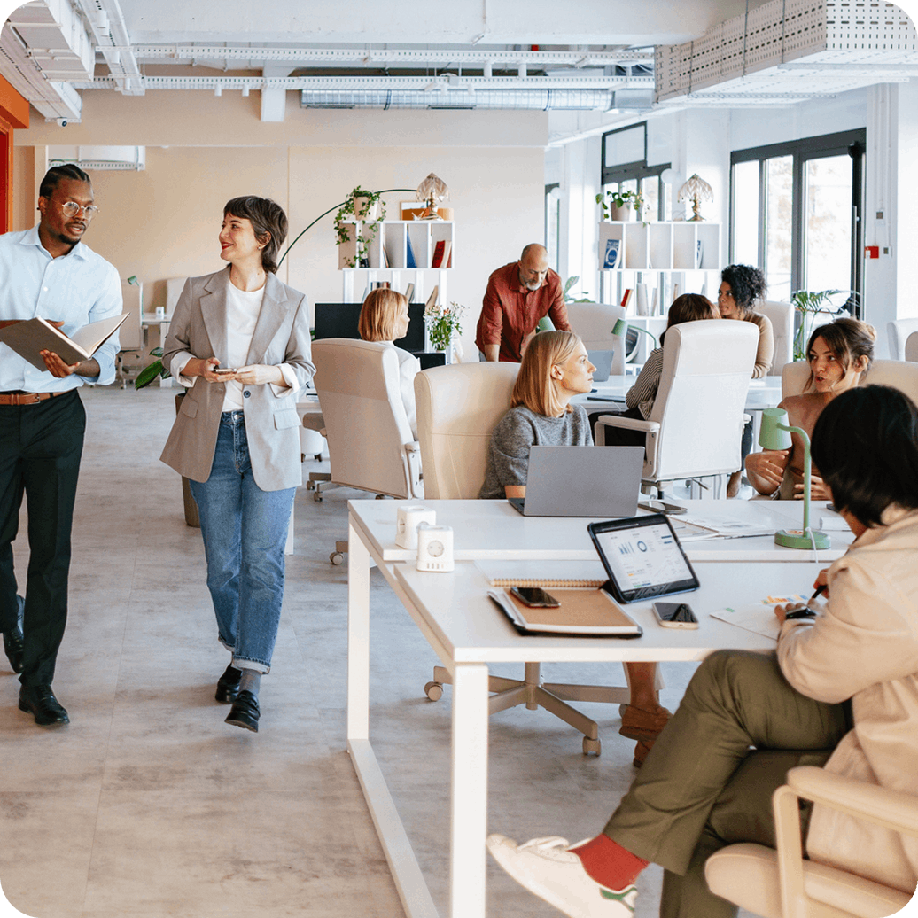 An open-plan corporate office interior with modern ergonomic workstations, natural lighting, and glass partitions. An open-plan corporate office interior with modern ergonomic workstations, natural lighting, and glass partitions.