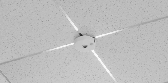 Infinity Area Sensor mounted to a standard ceiling tile, with no visible cabling.