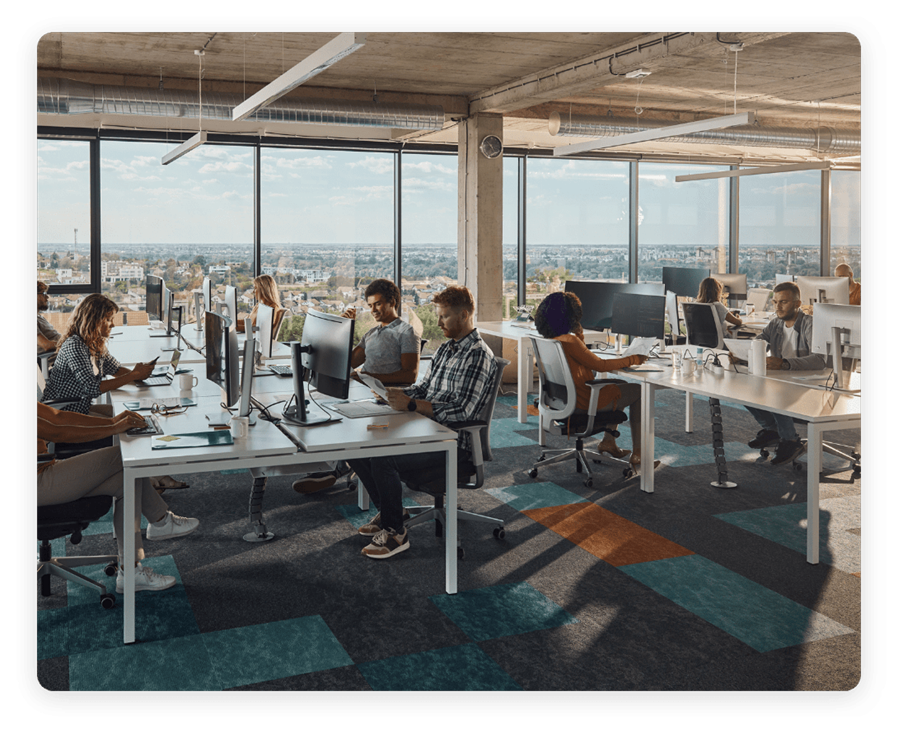 Employees working together in a open-plan collaborative office environment.